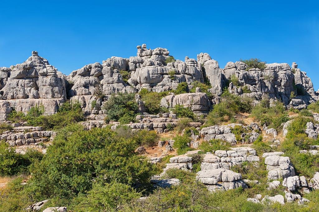 The dramatic and fascinating landscape of the El Torcal protected area is entrancing. Natural erosion has cut valleys and pathways through this enormous rock garden and created erratic sculptures in the process.